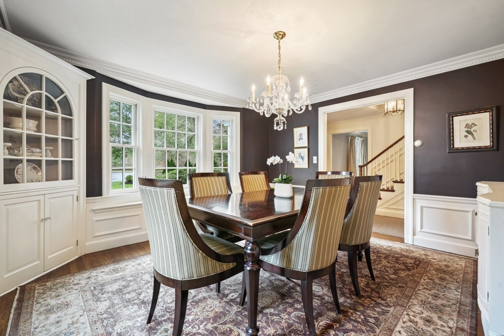 21 Alden Road Wellesley, MA 02481 - Photo 9 of 36 a view of a dining room with furniture a chandelier and wooden floor