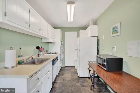 a large kitchen with cabinets
