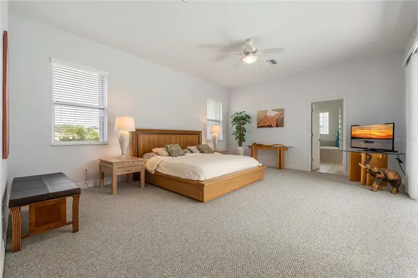 a large bathroom with a sink a large mirror and a shower