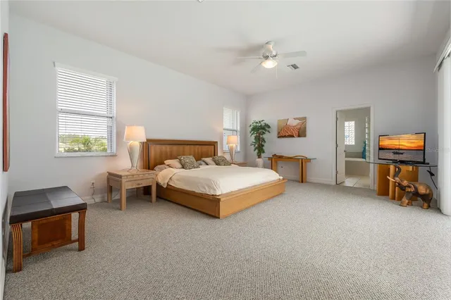 a large bathroom with a sink a large mirror and a shower