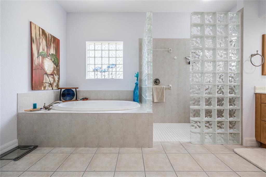 Undisclosed Address Punta Gorda, FL 33955 - Photo 19 of 46 a bath tub sitting in a bathroom next to a window