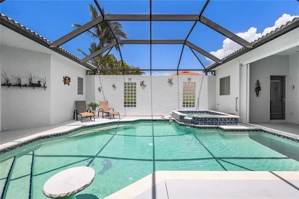 a view of swimming pool with outdoor seating
