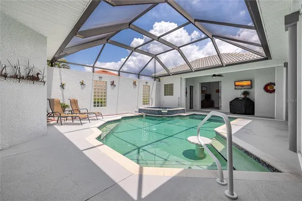 a backyard of a house with yard and outdoor seating