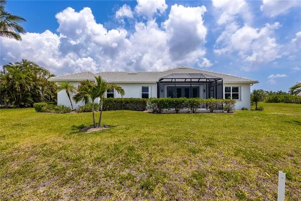 a roof deck with table and chairs a barbeque