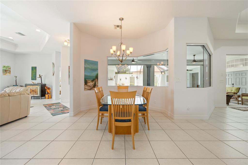 Undisclosed Address Punta Gorda, FL 33955 - Photo 9 of 46 a view of a dining room with furniture and chandelier