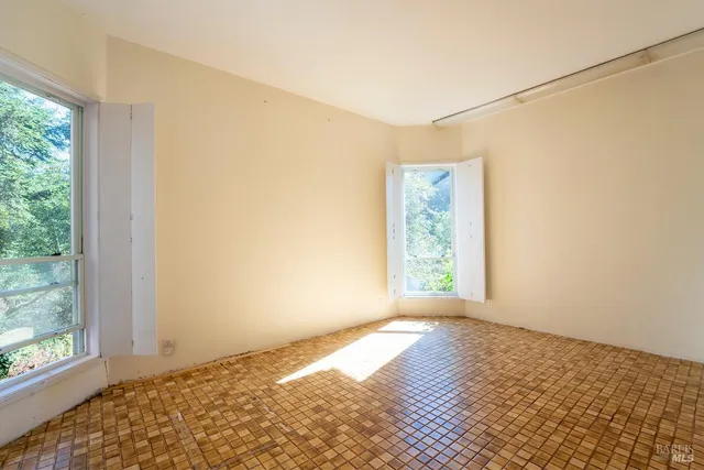 a view of an empty room and window