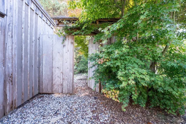 a view of a pathway with a yard