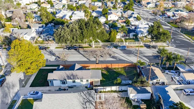 an aerial view of residential house with swimming pool and mountain view