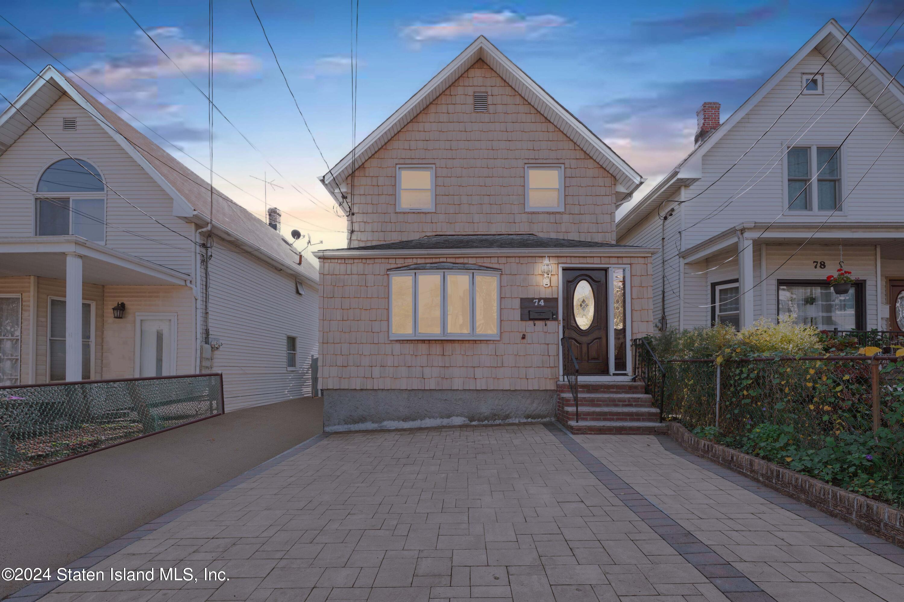 a view of a house with large windows