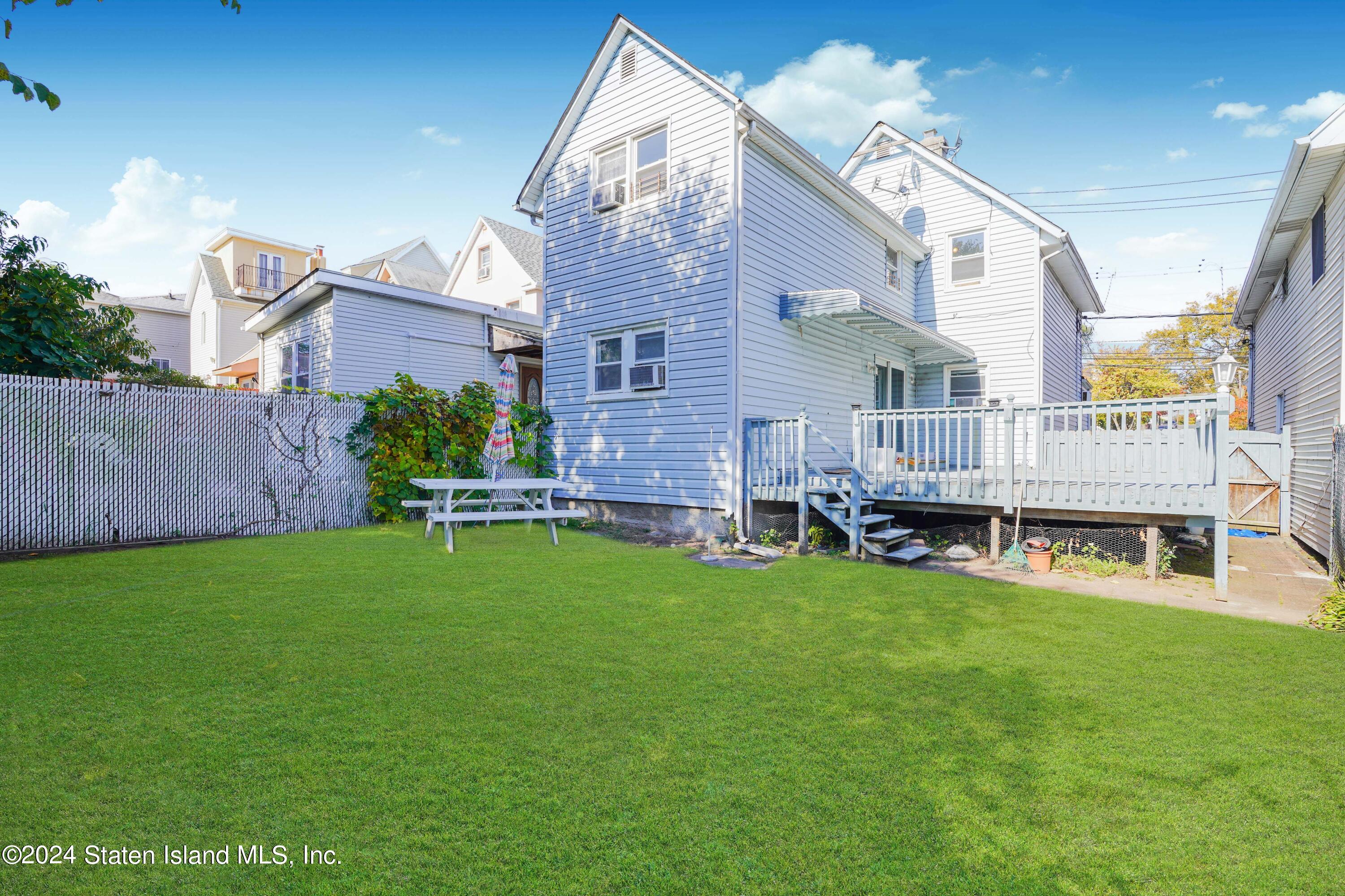 74 Fingerboard Road Staten Island, NY 10305 - Photo 3 of 18 a view of a house with backyard and sitting area