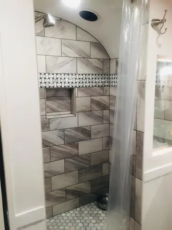 a bathroom with a toilet a sink and a mirror