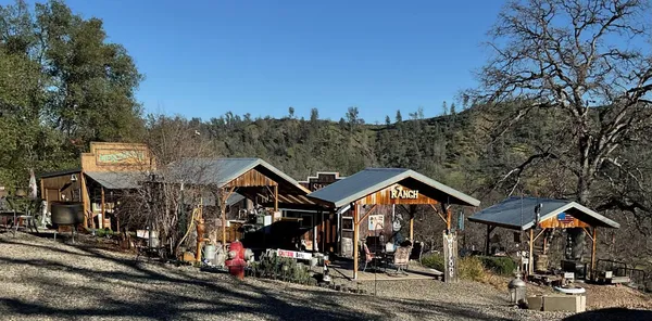 an outdoor space with seating area and barbeque oven