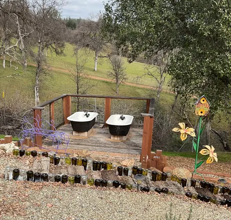 a view of a house with backyard and sitting area
