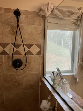 a view of a backyard with wooden fence