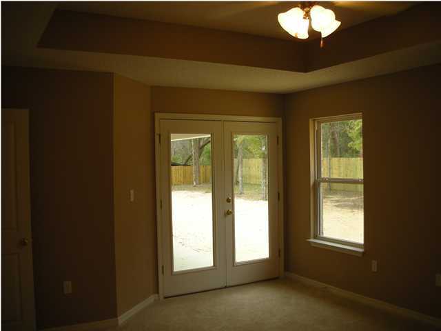 75 Eastern Street Freeport, FL 32439 - Photo 11 of 14 a view of an empty room with a window