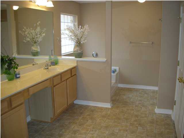 75 Eastern Street Freeport, FL 32439 - Photo 12 of 14 a bathroom with a shower sink and mirror