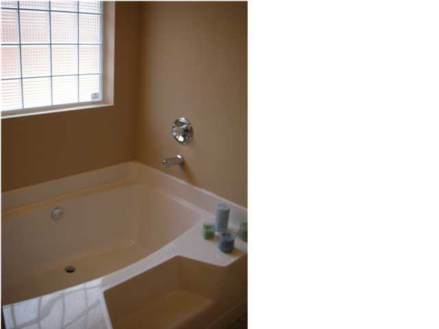 75 Eastern Street Freeport, FL 32439 - Photo 13 of 14 a bath tub sitting in a bathroom
