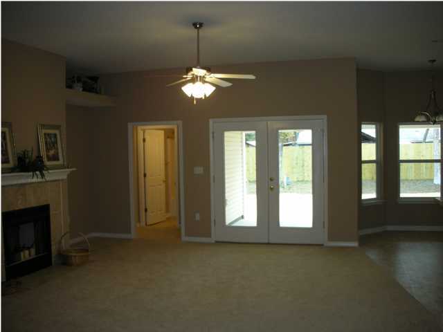 75 Eastern Street Freeport, FL 32439 - Photo 2 of 14 a view of a livingroom with a chandelier fan and windows
