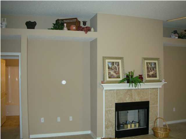 75 Eastern Street Freeport, FL 32439 - Photo 3 of 14 a living room with furniture and a fireplace