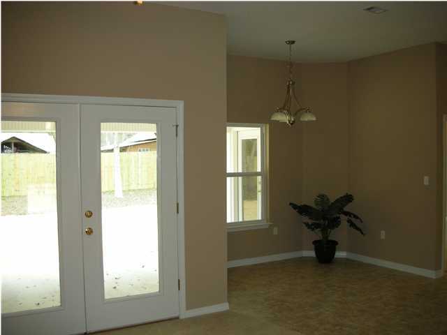75 Eastern Street Freeport, FL 32439 - Photo 5 of 14 a view of an empty room and window