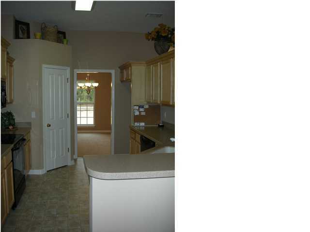 75 Eastern Street Freeport, FL 32439 - Photo 8 of 14 a view of a kitchen from the hallway