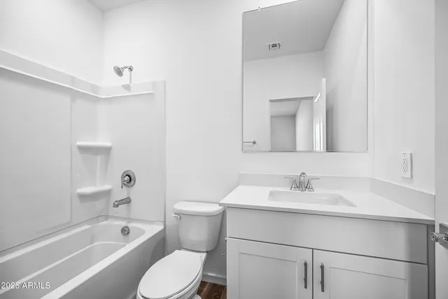 a bathroom with a toilet sink and bathtub