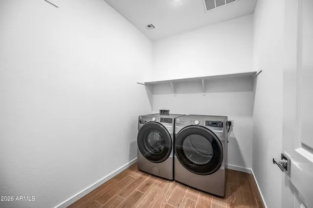 a utility room with dryer and washer