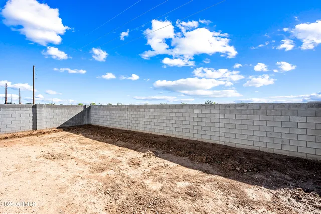 a view of a backyard of the house