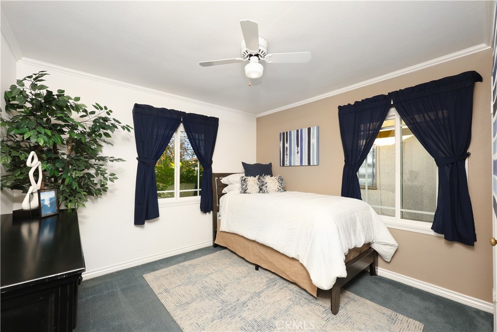 6116 Arbor Road Lakewood, CA 90713 - Photo 19 of 46 a spacious bedroom with a bed and a large window