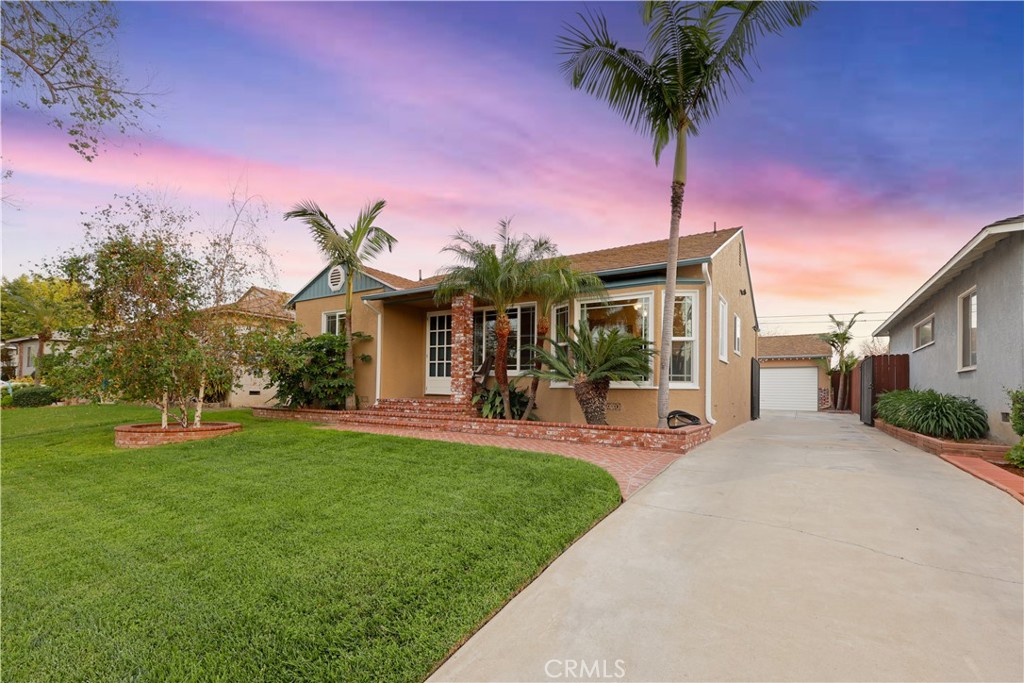 6116 Arbor Road Lakewood, CA 90713 - Photo 2 of 46 a front view of a house with a yard and porch