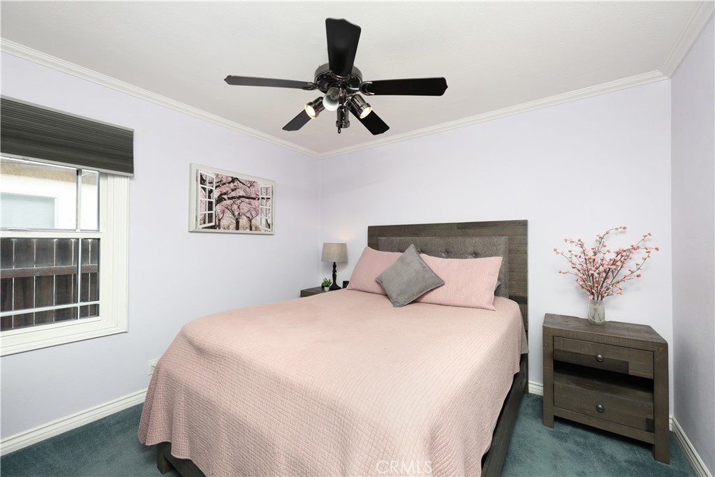 6116 Arbor Road Lakewood, CA 90713 - Photo 21 of 46 a bedroom with a bed and a painting on the wall