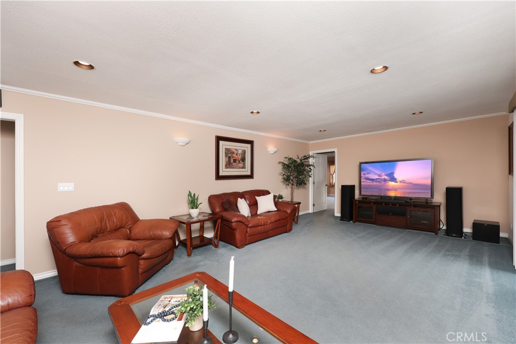 6116 Arbor Road Lakewood, CA 90713 - Photo 23 of 46 a living room with furniture and a flat screen tv