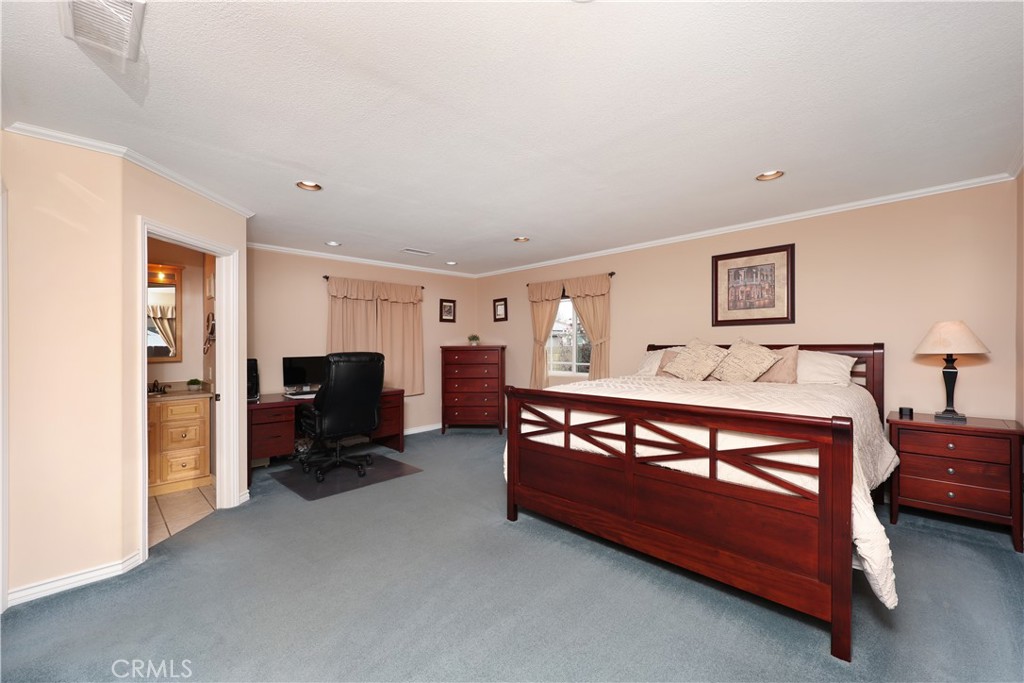 6116 Arbor Road Lakewood, CA 90713 - Photo 26 of 46 a bedroom with furniture and a flat tv screen