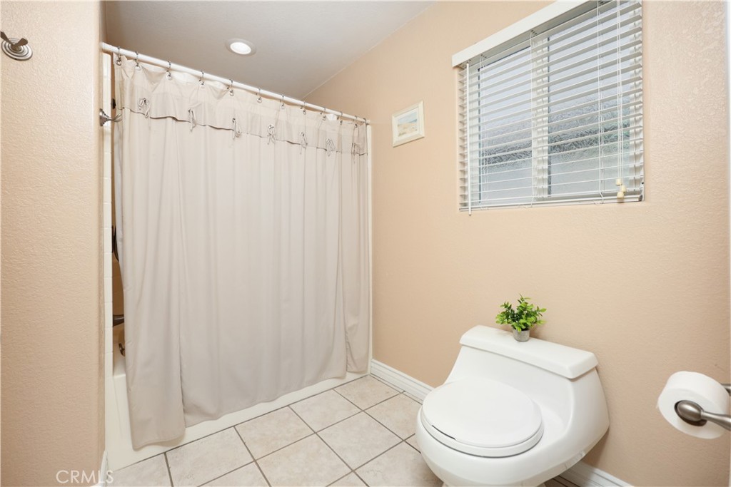 6116 Arbor Road Lakewood, CA 90713 - Photo 30 of 46 a white toilet sitting next to a bathroom sink