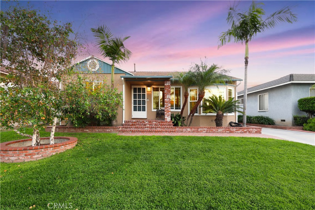 6116 Arbor Road Lakewood, CA 90713 - Photo 3 of 46 a view of a house with a yard porch and sitting area