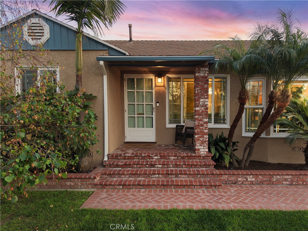 6116 Arbor Road Lakewood, CA 90713 - Photo 4 of 46 a front view of a house with garden