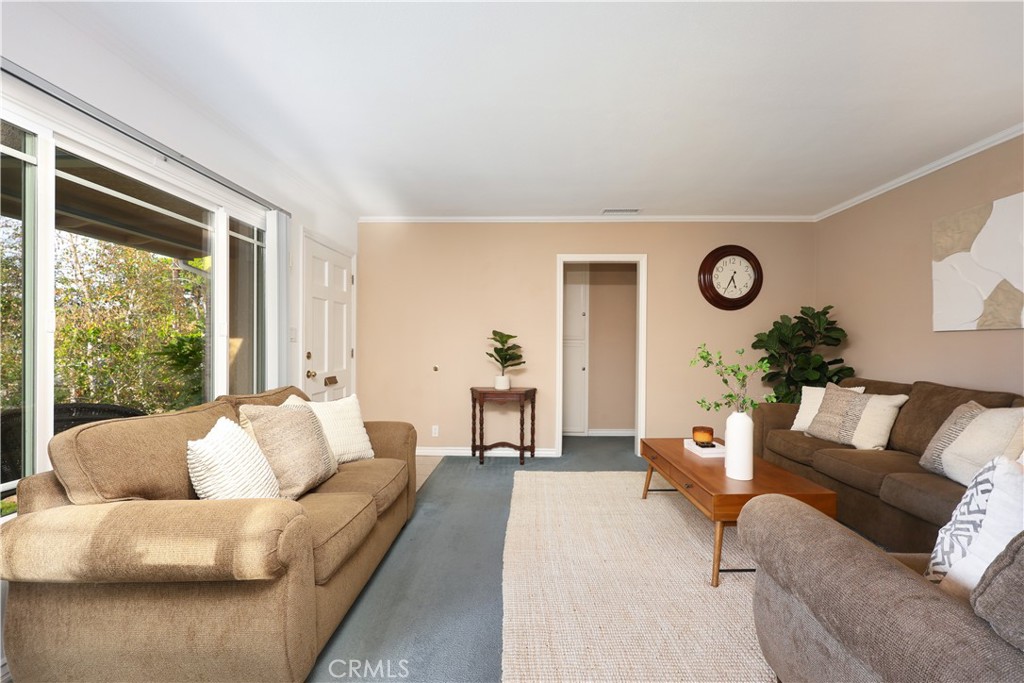 6116 Arbor Road Lakewood, CA 90713 - Photo 6 of 46 a living room with furniture and a large window
