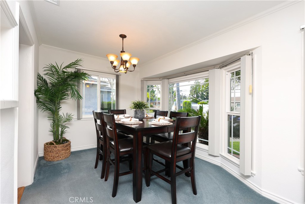 6116 Arbor Road Lakewood, CA 90713 - Photo 8 of 46 a view of a dining room with furniture window and wooden floor