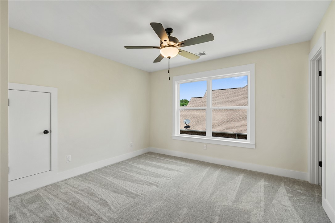 100 Garden Gate Drive Anderson, SC 29621 - Photo 30 of 43 This airy bedroom offers soft carpeting and ample natural light, creating a bright and inviting atmosphere.