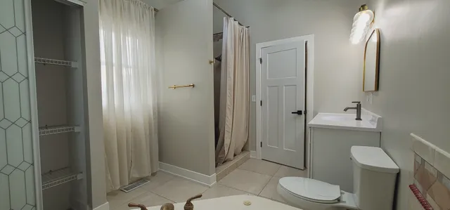 a bathroom with a shower and a tub
