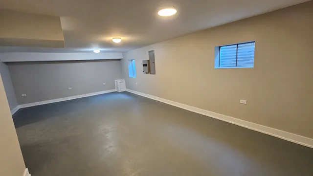 an empty room with a empty space and windows