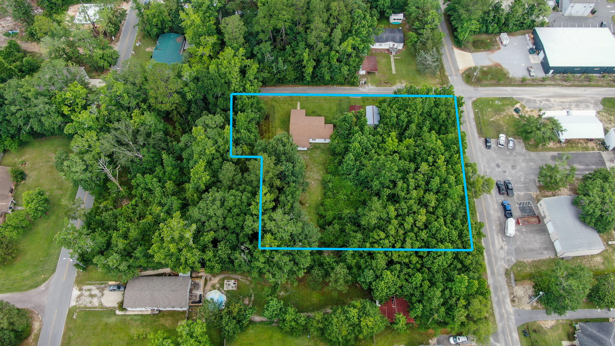 42 John Adams Street Freeport, FL 32439 - Photo 6 of 24 an aerial view of a house with a yard and lake view