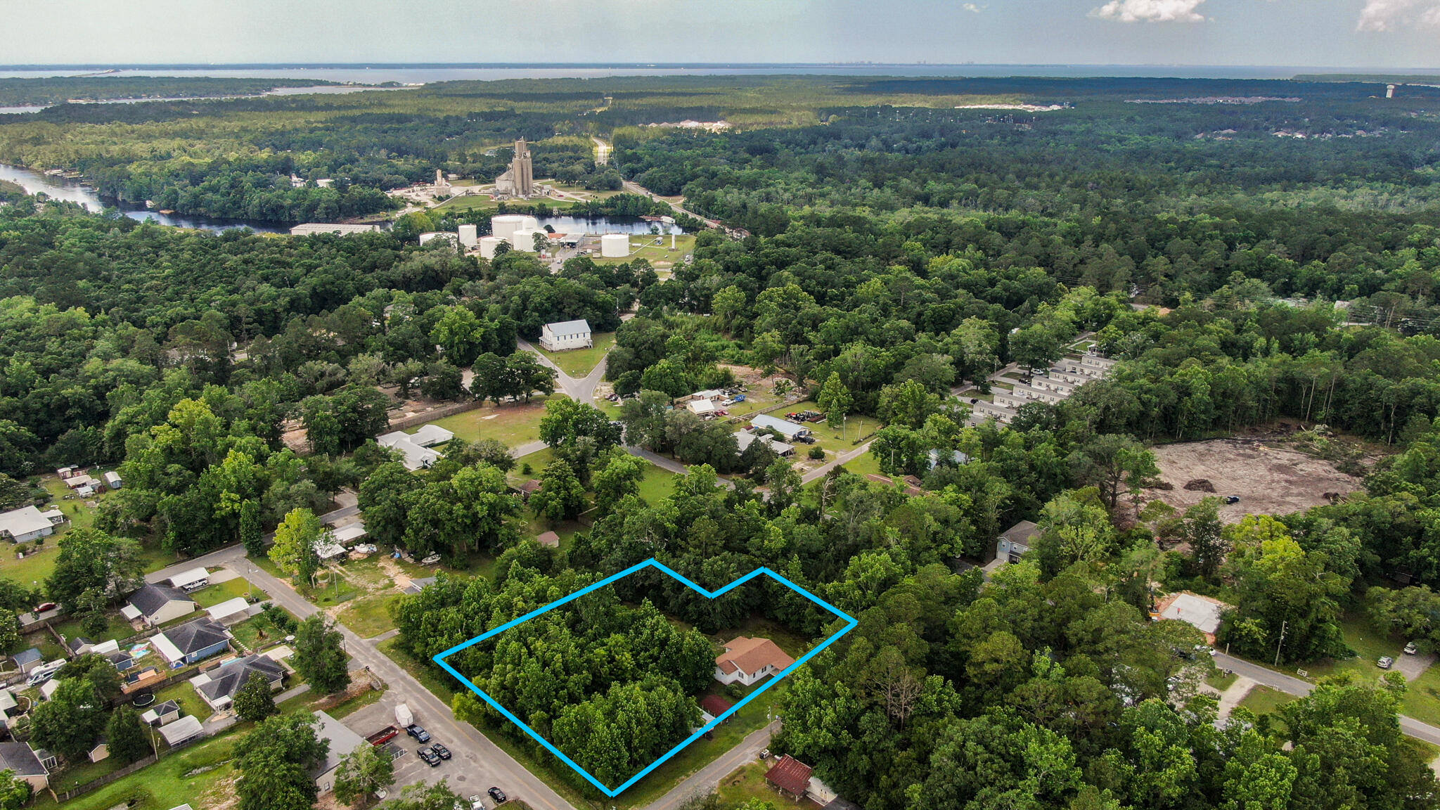 42 John Adams Street Freeport, FL 32439 - Photo 7 of 24 an aerial view of a residential houses with outdoor space and trees