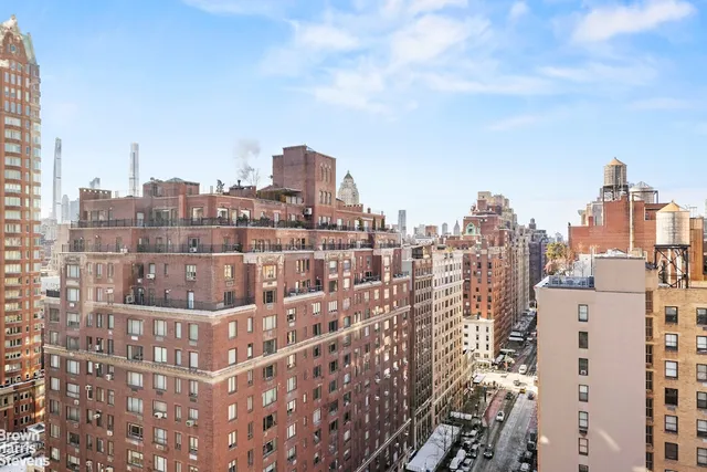a living room with furniture a rug and a window
