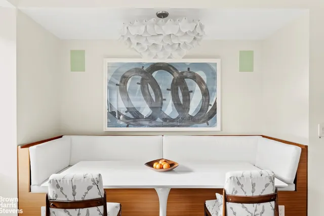 a kitchen with a sink cabinets and wooden floor