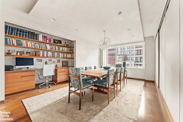 a utility room with a table and a fireplace