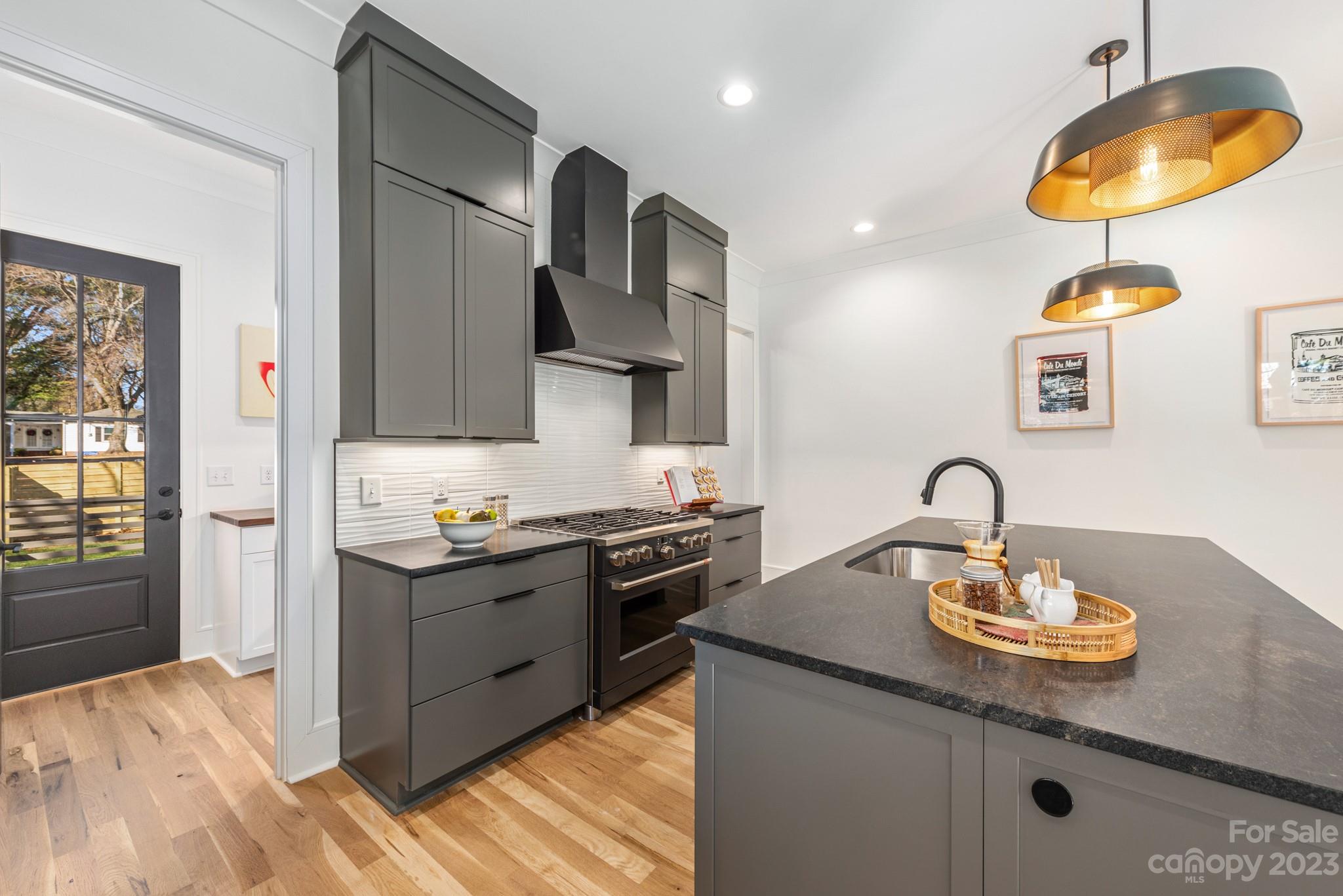 4338 Castleton Road Charlotte, NC 28211 - Photo 12 of 38 a kitchen with a sink a stove and cabinets