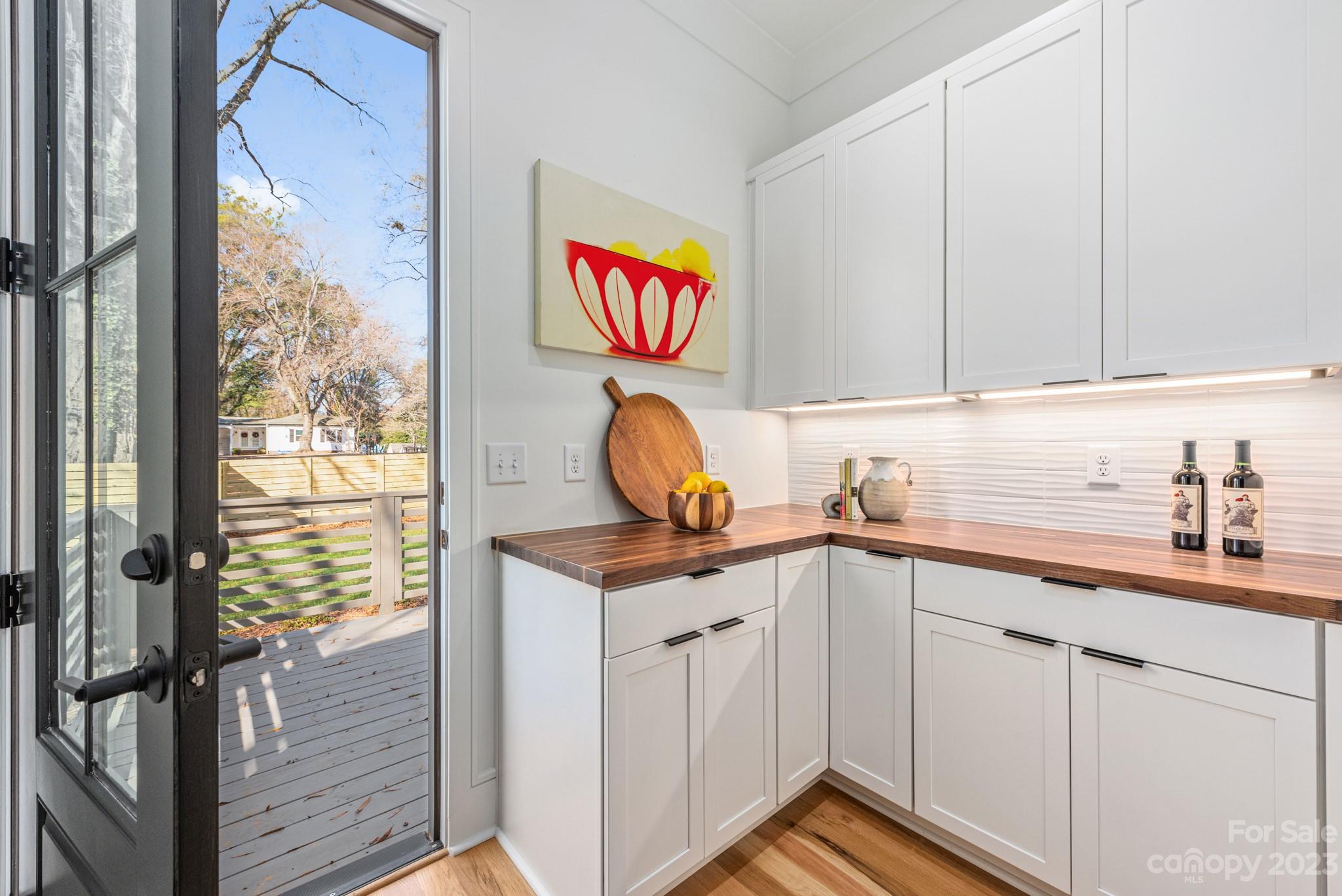 4338 Castleton Road Charlotte, NC 28211 - Photo 13 of 38 a kitchen with stainless steel appliances granite countertop a sink and a window