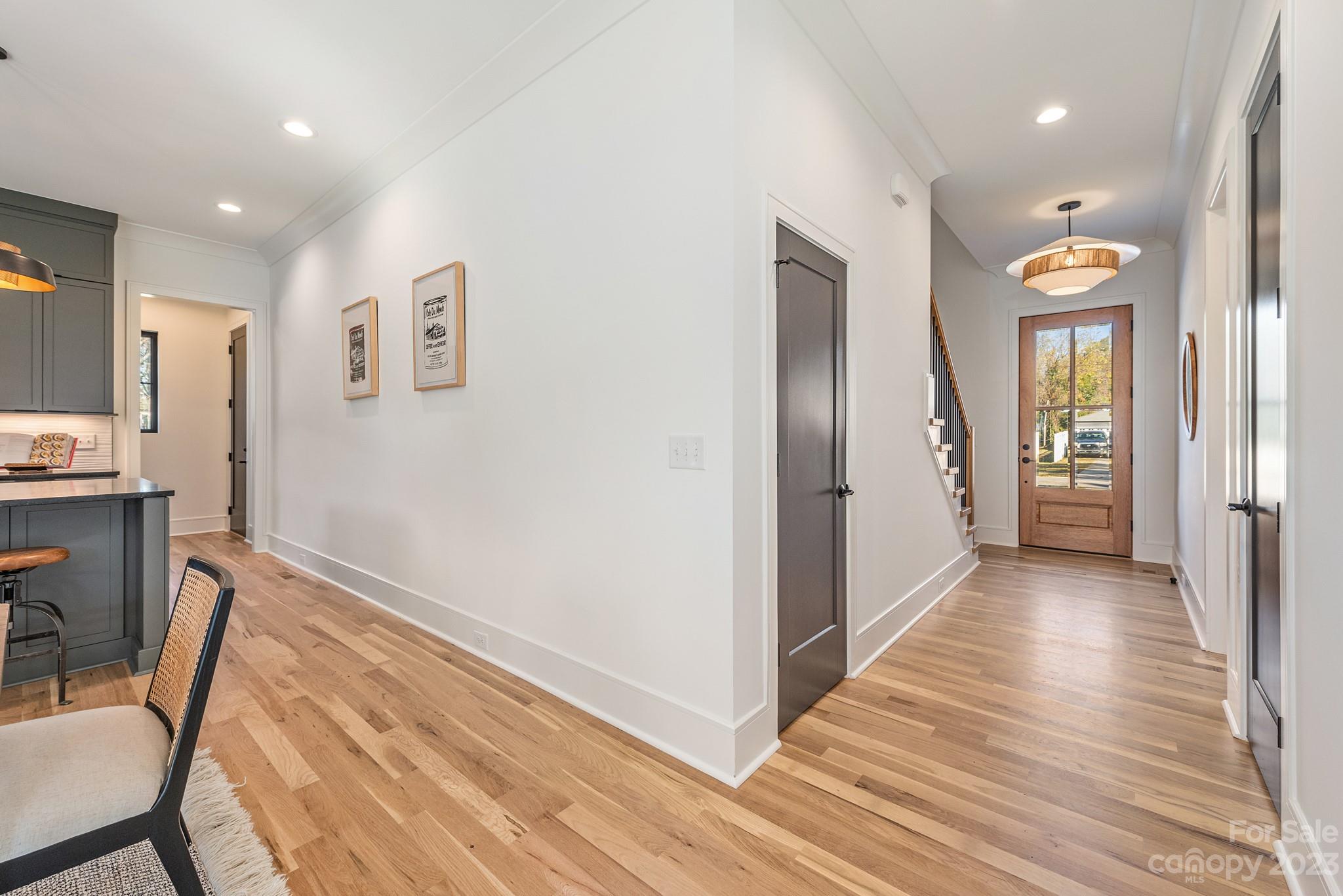 4338 Castleton Road Charlotte, NC 28211 - Photo 14 of 38 a view of a hallway with wooden floor and furniture