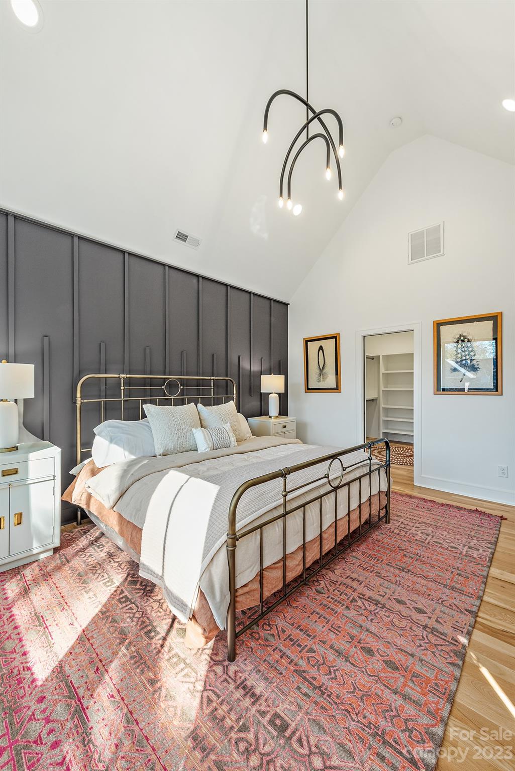 4338 Castleton Road Charlotte, NC 28211 - Photo 17 of 38 a spacious bedroom with a bed a rug and wooden floor